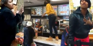 People arguing at fast food counter.