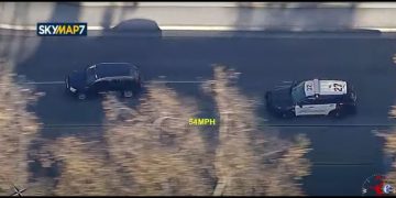 Police chase scene on highway at 54 mph.