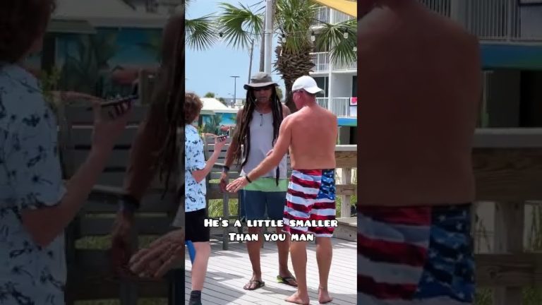 Three men talking on boardwalk, palm trees background.