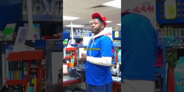 Employee stands frustrated in a convenience store.