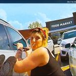 Woman caught outside supermarket parking lot