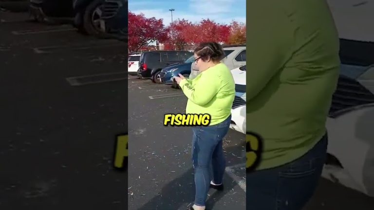 Person in parking lot with phone, fishing shirt