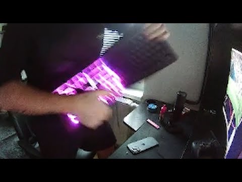 Person playing keyboard like a guitar with lights