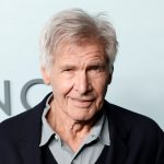 Smiling elderly man with gray hair in suit