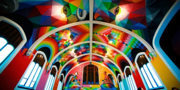 Vibrant colorful church interior with geometric patterns.