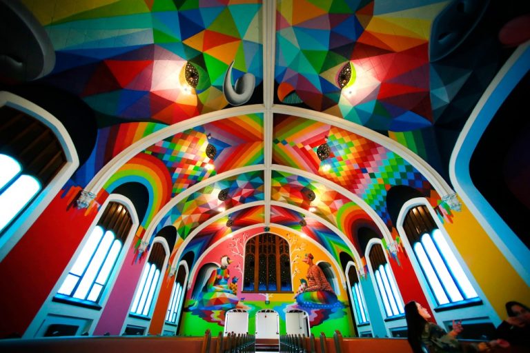 Vibrant colorful church interior with geometric patterns.