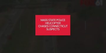 Massachusetts police helicopter pursues Connecticut suspects.