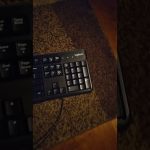 Black Logitech keyboard on brown carpet