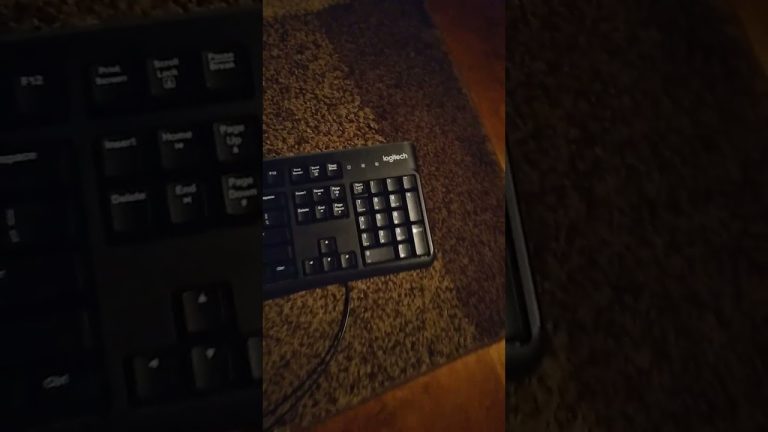 Black Logitech keyboard on brown carpet