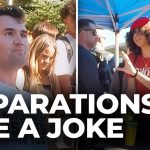 Group debating reparations under tent