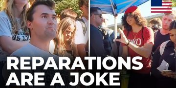 Group debating reparations under tent