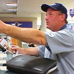 Airport staff assisting traveler at check-in desk