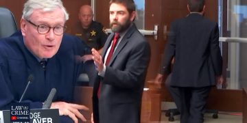 Judge and lawyer in courtroom discussion