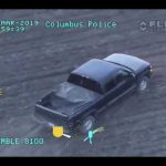 Aerial view of police-tracked pickup truck.