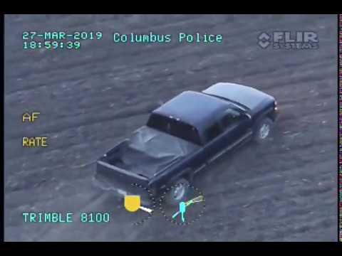 Aerial view of police-tracked pickup truck.