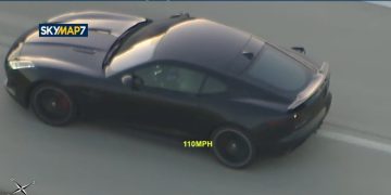 Car speeding on highway at 110 mph