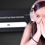 Gamer shocked by console ban notification screen.