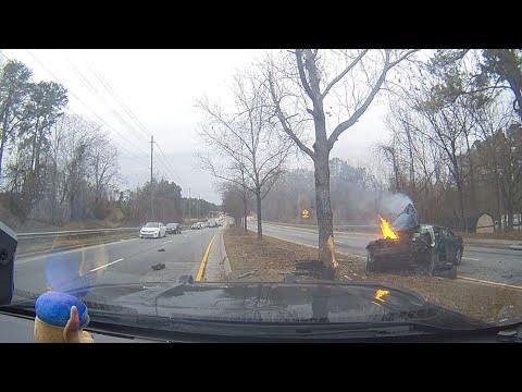 Car crash into tree with engine fire.