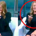 Woman laughing on TV show