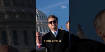 People standing in front of U.S. Capitol building.