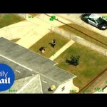 Aerial view of police near a suburban house.