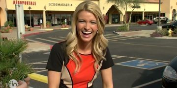 Woman laughing outside a shopping center