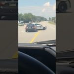 Police car stops vehicle on highway