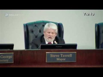 Man speaking at a council meeting.