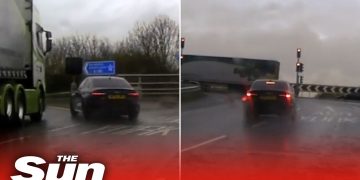 Car and truck in rainy road scene.