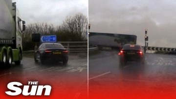 Car and truck in rainy road scene.