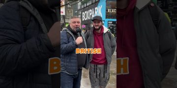 Two men smiling outside Boxpark Camden.