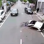 Car crash with overturned vehicle on city street.