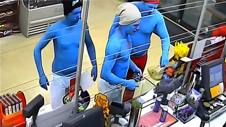 Three blue-painted people at a store checkout