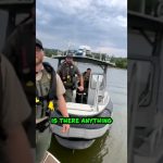 Police officers on a boat with cloudy sky.