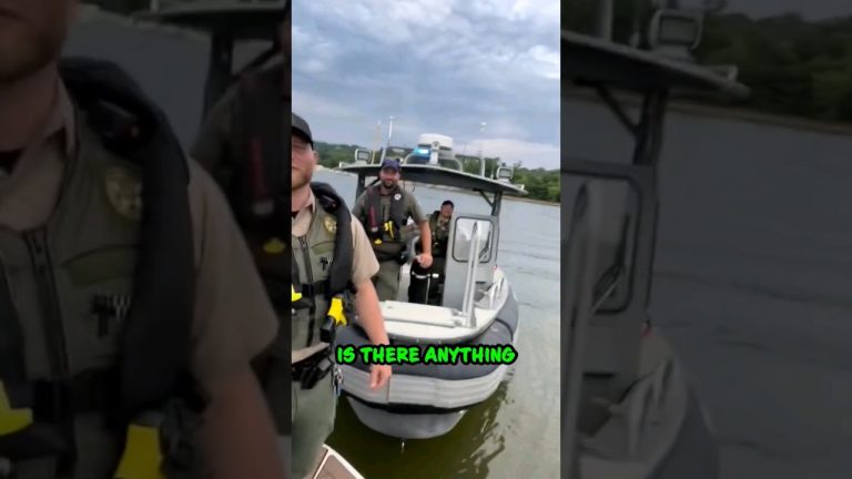 Police officers on a boat with cloudy sky.