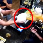 Woman throws food at another in restaurant.