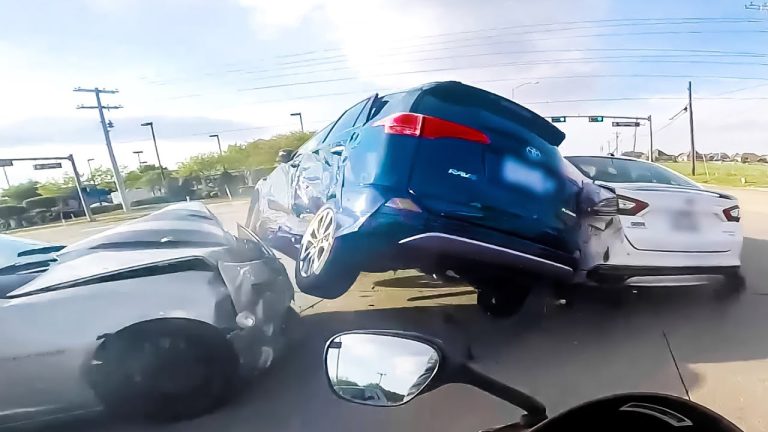 Multiple cars in a collision at intersection.