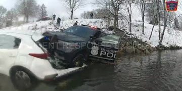 Car crash into river with police vehicle