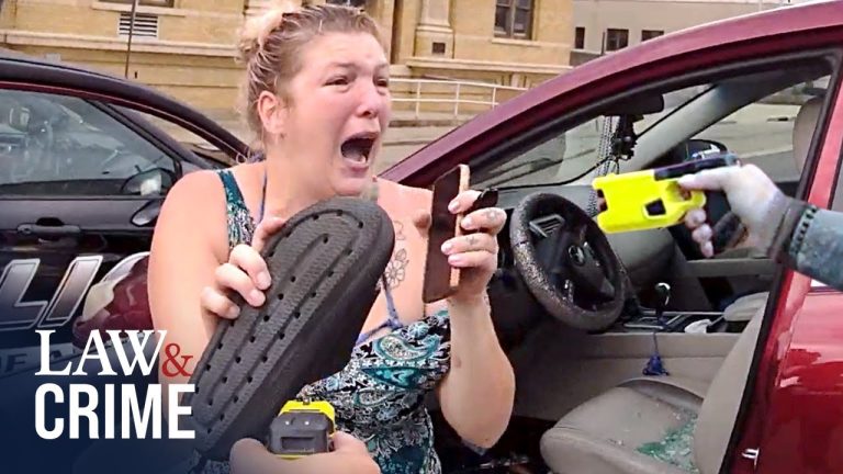 Woman in distress, taser and shoe visible