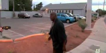 Man in parking lot during TV interview