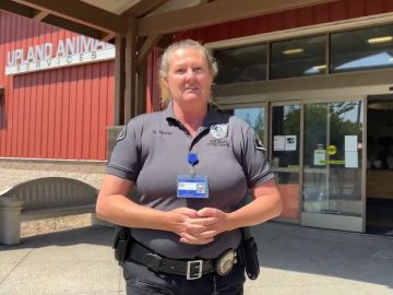 Animal control officer at Upland Animal Services entrance.