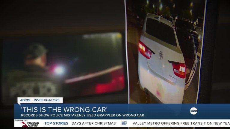 Police mistakenly use grappler on wrong car.