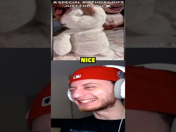 Person laughing at birthday gift teddy bear