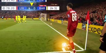 Soccer player preparing corner kick during match.