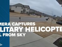 Security camera footage of helicopter crash in neighborhood.