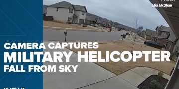 Security camera footage of helicopter crash in neighborhood.