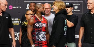 Two fighters facing off at a UFC event.