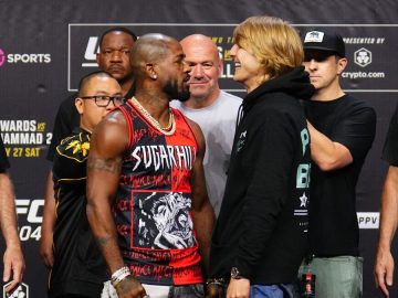 Two fighters facing off at a UFC event.