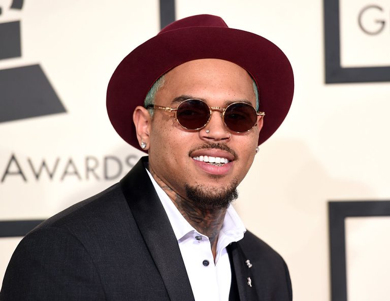 Man in maroon hat and sunglasses at event