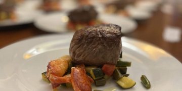 Grilled steak with mixed vegetables on plate